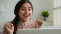 Happy shocked arabian woman girl student looking at laptop screen at home surprised get good exam results celebrate Royalty Free Stock Photo