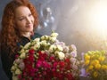 Happy shop assistant has got flowers from friend