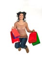 Happy shopper woman jumping