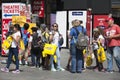 Happy shoppers with yellow packets of M