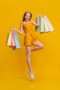 Happy Shopping. Overjoyed Girl Jumping In Air With Shopper Bags Royalty Free Stock Photo