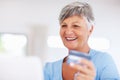 Happy shopping. Smiling mature woman shopping online using laptop and credit card. Royalty Free Stock Photo