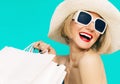 Happy shopping summer lady on blue background Royalty Free Stock Photo