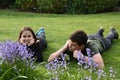 Siblings relaxing in garden Royalty Free Stock Photo