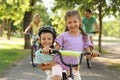 Happy siblings and their parents riding bicycles Royalty Free Stock Photo