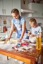 Happy siblings trying hand at making dough