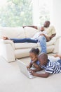 Happy siblings using their laptop Royalty Free Stock Photo