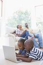 Happy siblings using their laptop Royalty Free Stock Photo