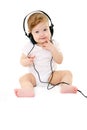 Happy singing baby with black headphones Royalty Free Stock Photo