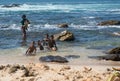 Happy Sinhalese family washing coconuts