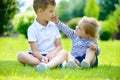 Happy sister and brother together in park