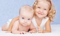 Happy sister hugging baby brother Royalty Free Stock Photo