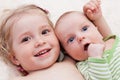 Happy sister hugging baby brother Royalty Free Stock Photo