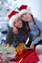 Happy sisters festive surprise Royalty Free Stock Photo