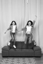 Happy sisters jump in freedom sense. mother and daughter having fun on weekend. move in new house. full of energy. real Royalty Free Stock Photo