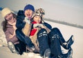 Happy sisters sledding Royalty Free Stock Photo