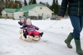 Happy sisters sledding Royalty Free Stock Photo