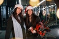 Happy sisters twins spends Christmas holidays together outdoors. Conception of new year Royalty Free Stock Photo