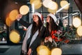 Happy sisters twins spends Christmas holidays together outdoors. Conception of new year Royalty Free Stock Photo