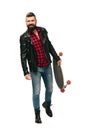 Happy skateboarder in black leather jacket posing with longboard isolated Royalty Free Stock Photo