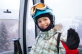 Happy skier girl on ski lift. Royalty Free Stock Photo