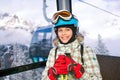 Happy skier girl on ski lift. Royalty Free Stock Photo