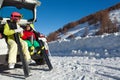 Happy skiers drinking warm tea from thermos Royalty Free Stock Photo