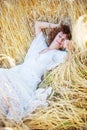 Happy sleeping woman in wheat field