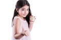 Happy small beautiful girl with dark hair and eyes holding white onion on hands and thumbs up looking at camera and smiling.