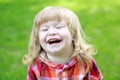 Happy small boy on green grass Royalty Free Stock Photo