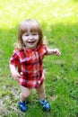 Happy small boy on green grass Royalty Free Stock Photo