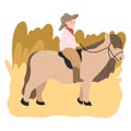 Happy small boy in hat sitting on brown pony back and riding Royalty Free Stock Photo