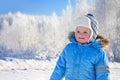 Happy small child the boy on walk in the winter in park Royalty Free Stock Photo