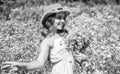 Happy small girl collecting flowers and herbs on sunny day, feel free concept Royalty Free Stock Photo