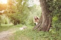 Happy small girl outdoor. Girl having fun in spring park. Blurred background in sunset Royalty Free Stock Photo