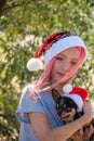 Small girl in santa hat with present have a christmas. little girl in red santa hat. Girl in santa hat Royalty Free Stock Photo