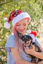 Small girl in santa hat with present have a christmas. little girl in red santa hat. Girl in santa hat Royalty Free Stock Photo