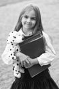 Happy small kid in school uniform hold study books and toy dog friend, friendship Royalty Free Stock Photo