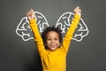 Happy smart black child student boy with big brain