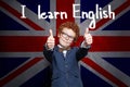 Happy smart successful child boy is ready for English exam. Learn English concept