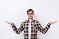 Happy smart young worker in glasses making presentation of two different options