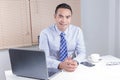 Happy smile asian business man sitting in office Royalty Free Stock Photo