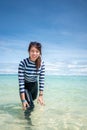 Happy smile Asian woman standing in sea water, Woman wear swimming suit, Travel vacation concept Royalty Free Stock Photo