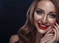 Closeup portrait of smiling caucasian young woman model with glamour red lips, bright makeup. Royalty Free Stock Photo