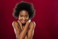 Joyful cute young woman showing her optimistic mood