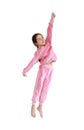 Happy and smile little Asian child girl in pink tracksuit or sport cloth jumping on air isolated over white background. Freedom Royalty Free Stock Photo