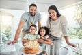 Happy, smile and portrait of a family at birthday celebration with cake, candles and fun hats at home. Happiness Royalty Free Stock Photo