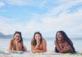 Happy, smile and portrait with friends on beach for travel, diversity and summer break with blue sky mockup. Sunbathing