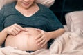 Happy smile pregnant asian woman touching her belly, Mother play with her baby, pregnancy, Maternity prenatal care and woman