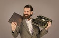 Happy smile. successful businessman use retro typewriter and computer. mature man hold vintage device. first draft Royalty Free Stock Photo